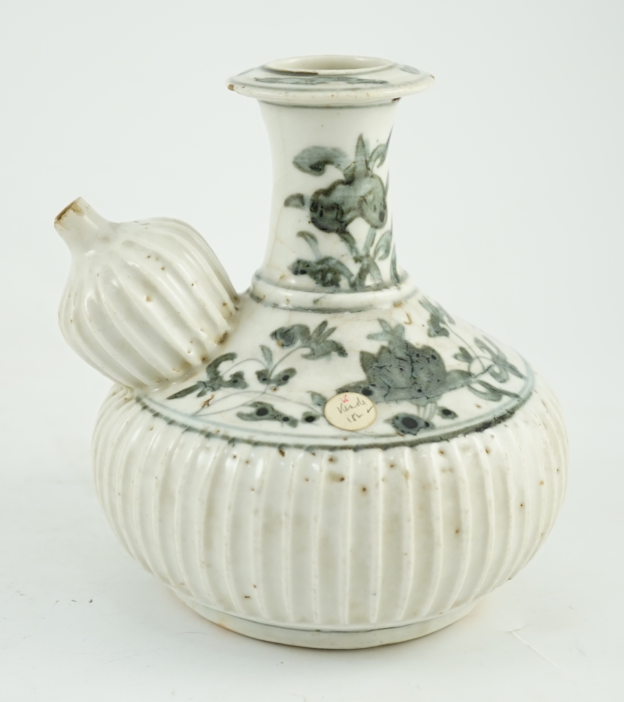 A Chinese late Ming blue and white fluted kendi, Zhangzhou kilns, 16cm high, small chips and glaze cracks